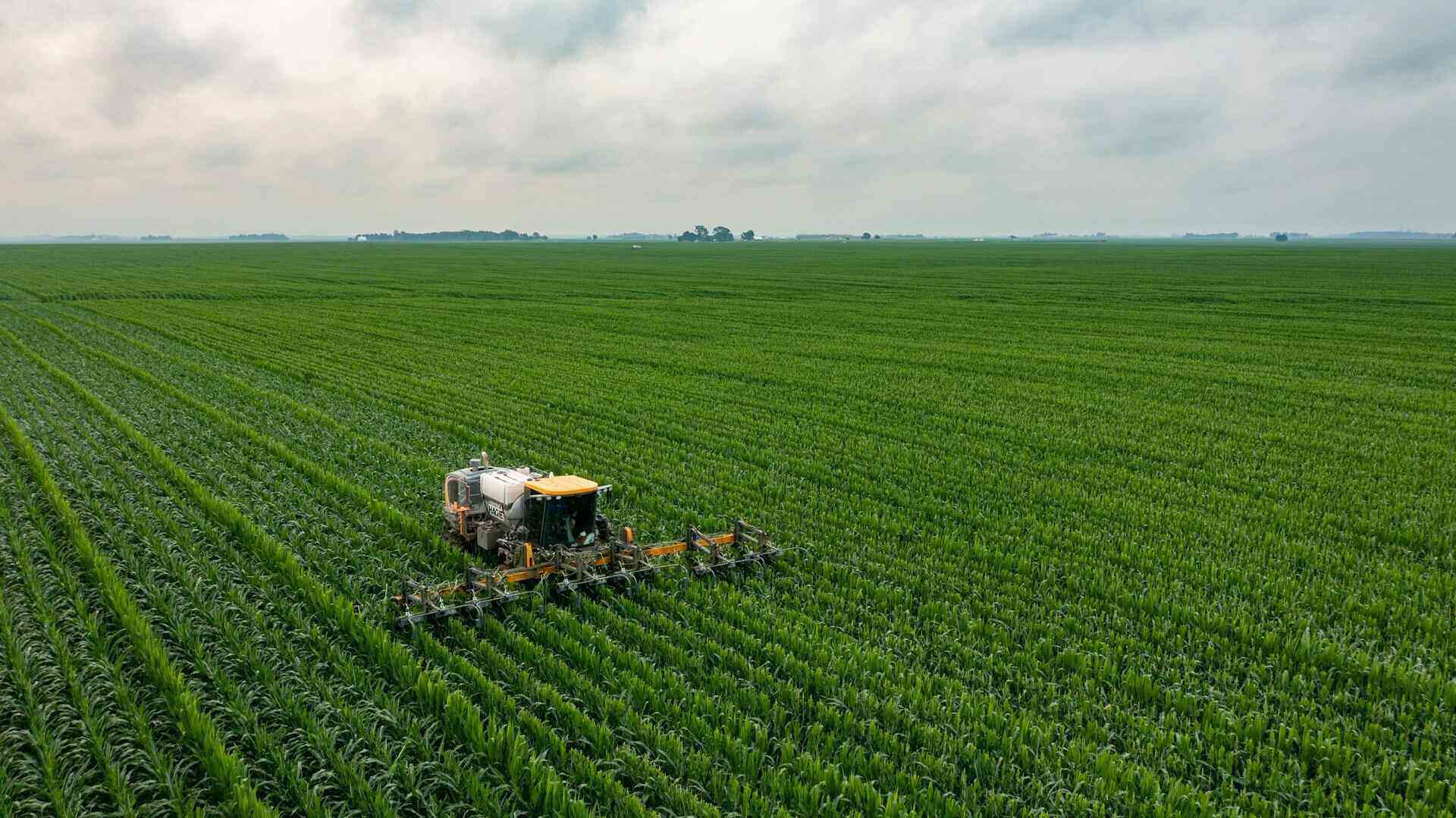 Tractor that is harvesting the crops